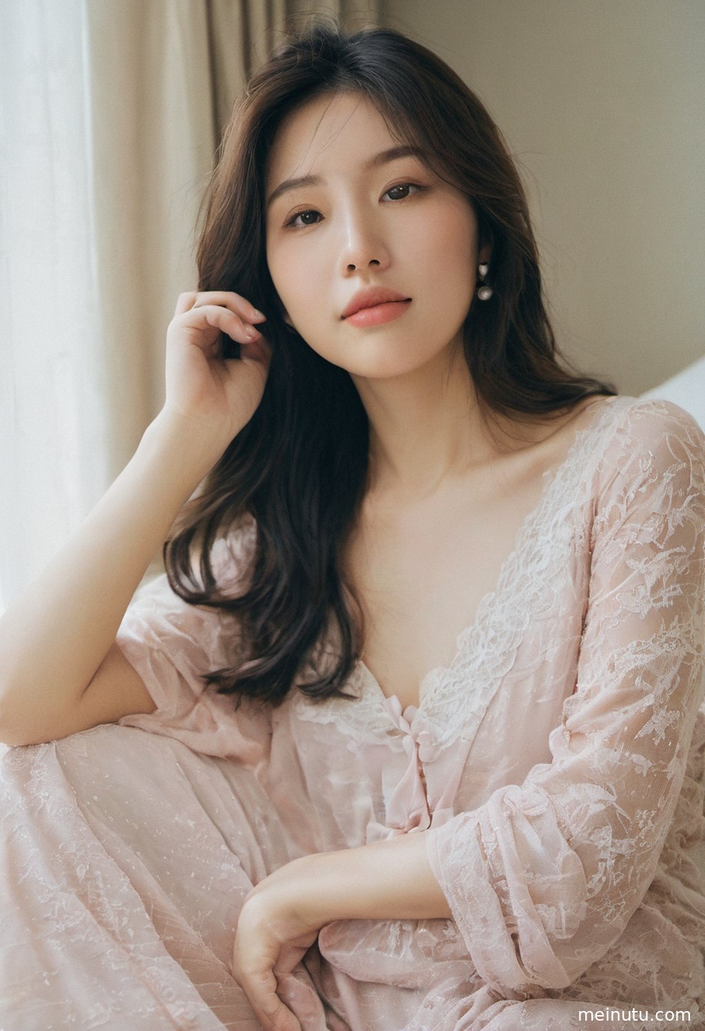 An adult Asian woman poses in a private indoor setting under warm sunset side light.
