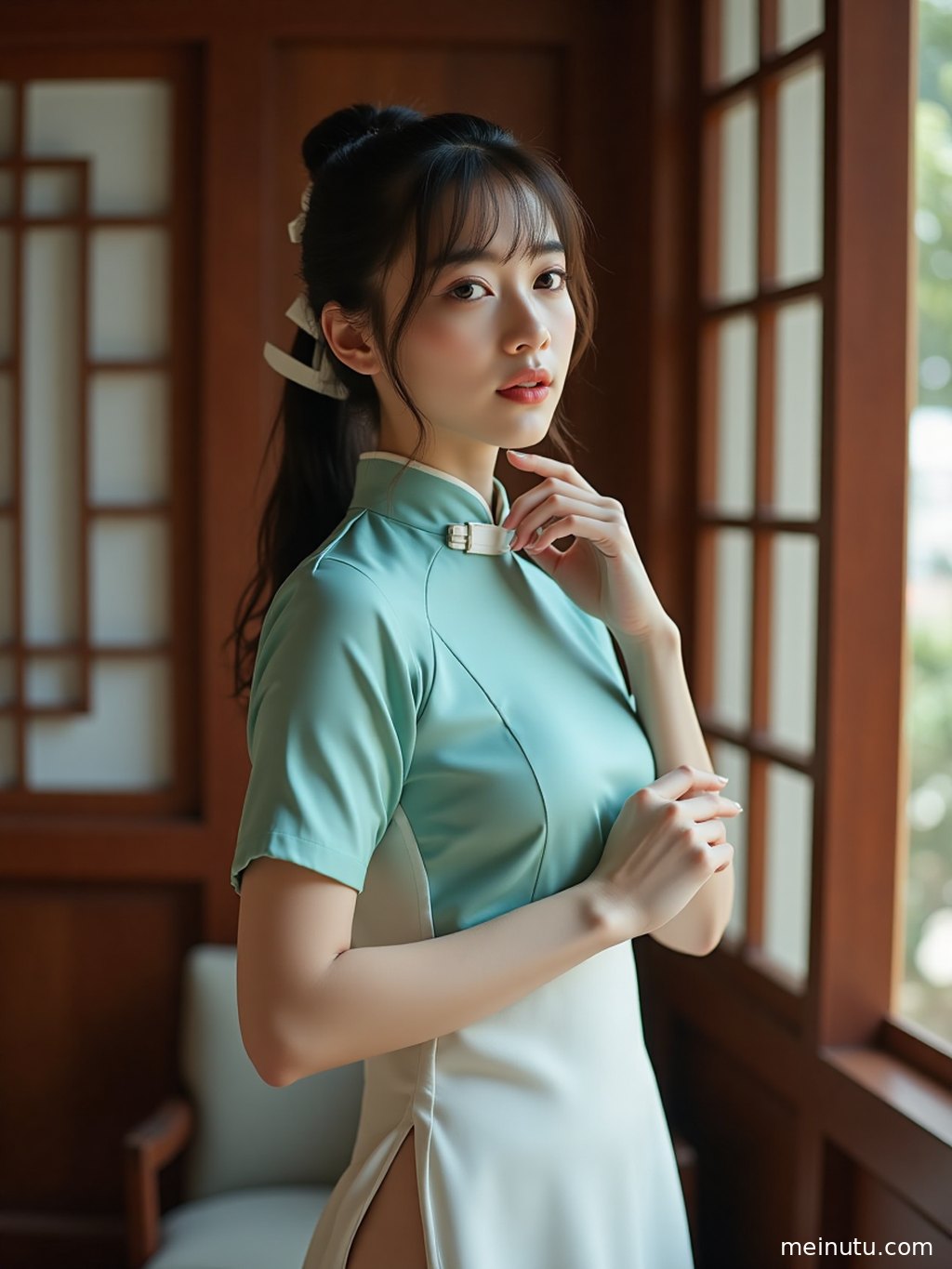Modern cheongsam dress with side slits flowing in the sea breeze during a summer portrait session.